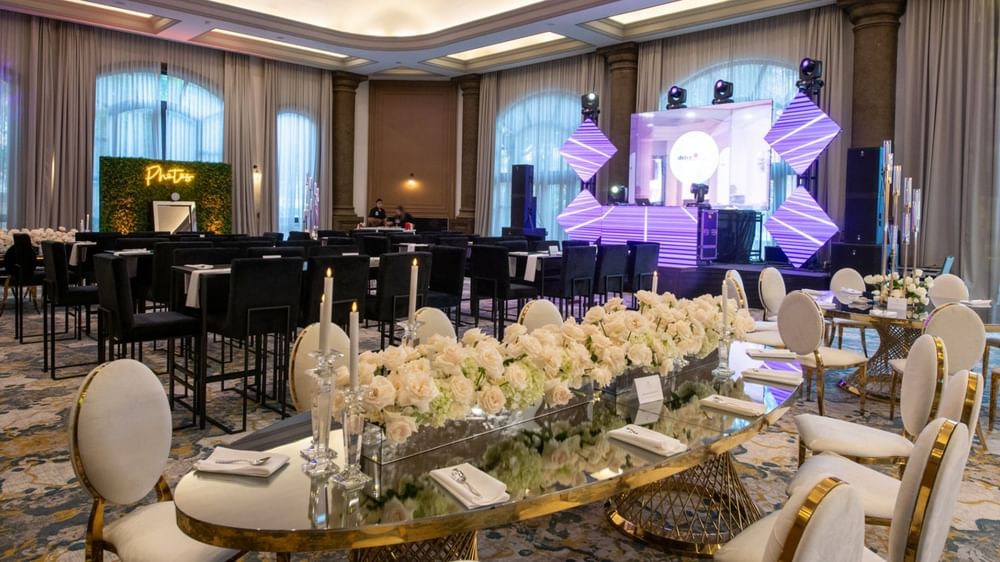 Gran Salon set for an event with white roses and modern purple LED stage at Quinta Real Monterrey