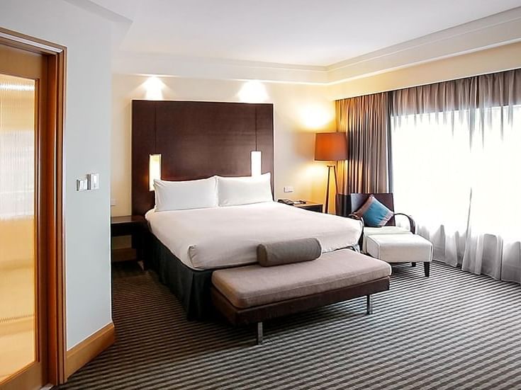 Large bed & sofa bed in club suite at Amara Hotel Singapore