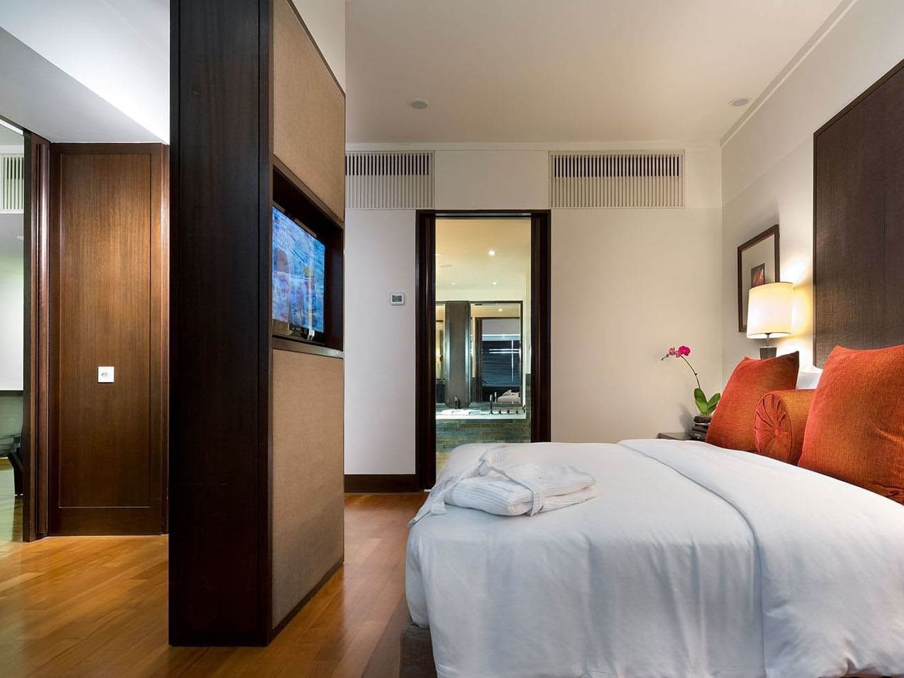 Modern Premium Room at The Saujana Hotel Kuala Lumpur with a tidy bed and a view of the dining area