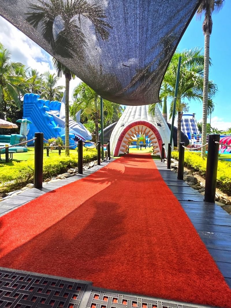 Big Bula Waterpark Nadi with Red carpet path leading to a vibrant outdoor play area near TokaToka Resort Nadi Fiji