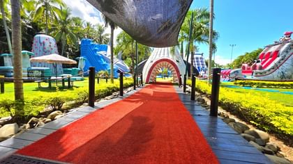 Big Bula Waterpark Nadi with Red carpet path leading to a vibrant outdoor play area near TokaToka Resort Nadi Fiji