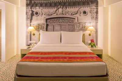 Closeup of a king bed in Deluxe Poolside Room at Goodwood Hotel
