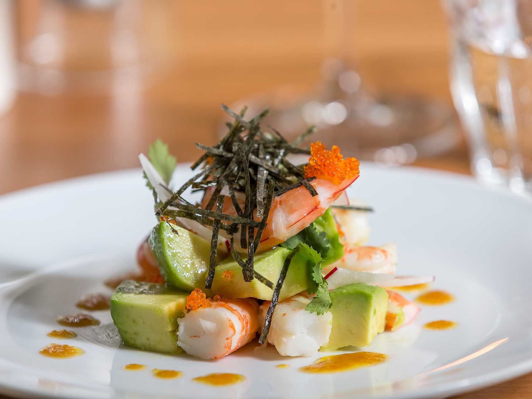 Closeup of a prawn dish at Le Petit Flot at Tank Stream Sydney