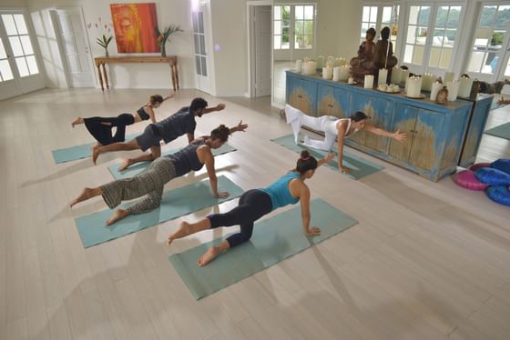 Ladies doing yoga on a mat at Retreat Costa Rica