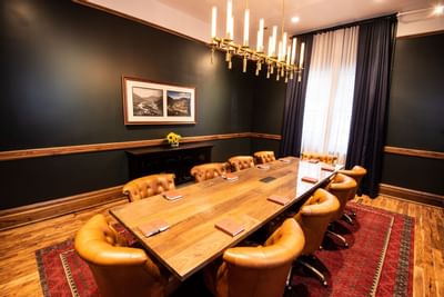 Table and chairs in the 1893 Boardroom at the Hotel Colorado