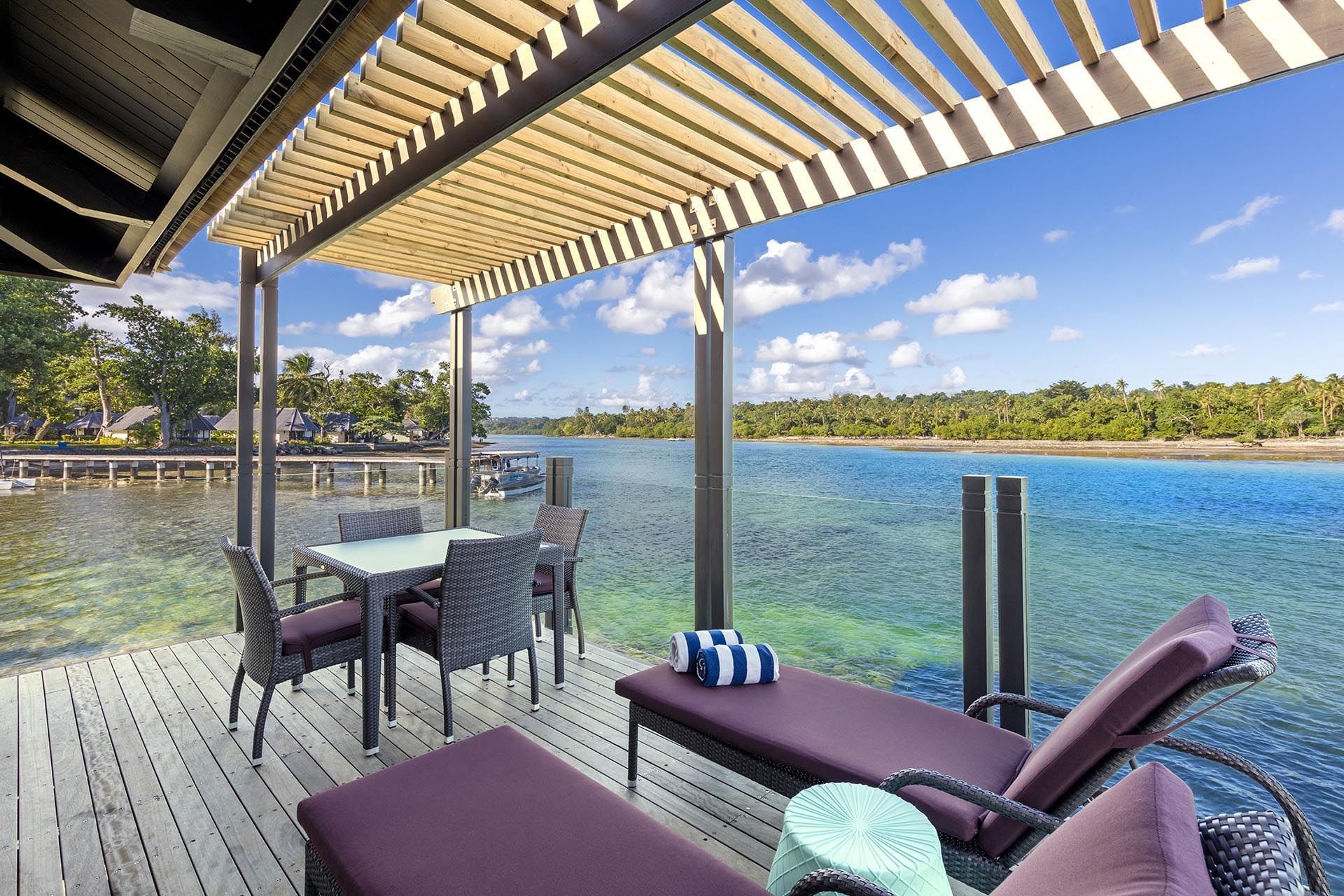 Dining & lounge area in Overwater Villas at Warwick Le Lagon