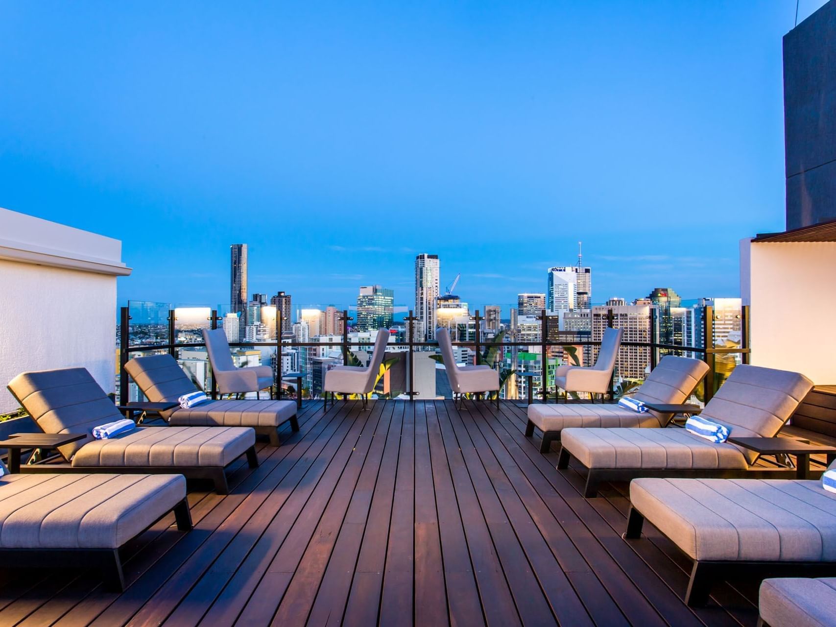 Lounge chairs on the rooftop at Grand Chancellor Brisbane