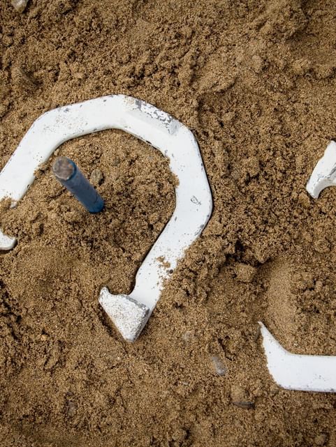 Close-up of Horseshoes on the sand, featuring the Horseshoe game at Cove Pocono Resorts