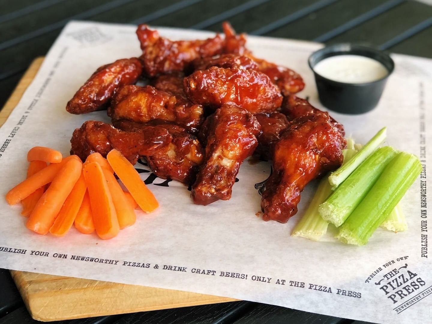 Chicken wings, carrots, celery & sauce at The Anaheim Hotel