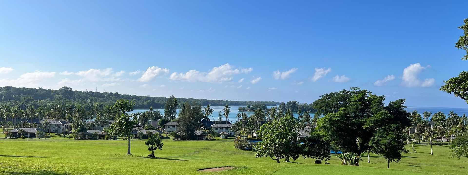 Lush green golf course with ocean view at Warwick Le Lagon - Vanuatu, Efate