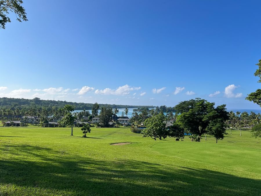 Lush green golf course with ocean view at Warwick Le Lagon - Vanuatu, Efate