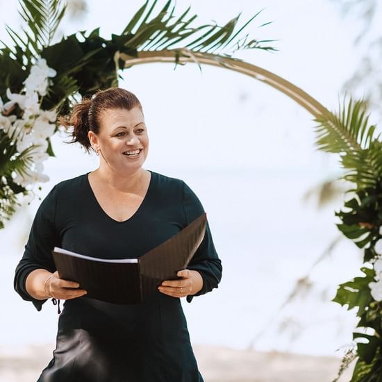 Lady with a book at Pullman Palm Cove Sea Temple Resort & Spa