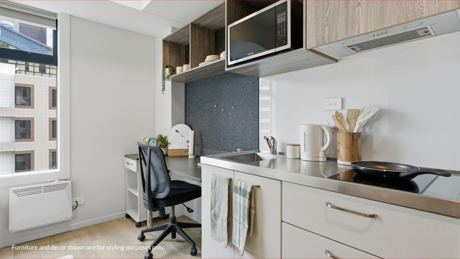 Stylish kitchen area with microwave, sink, and desk at Mayoral Drive Student Accommodation.
