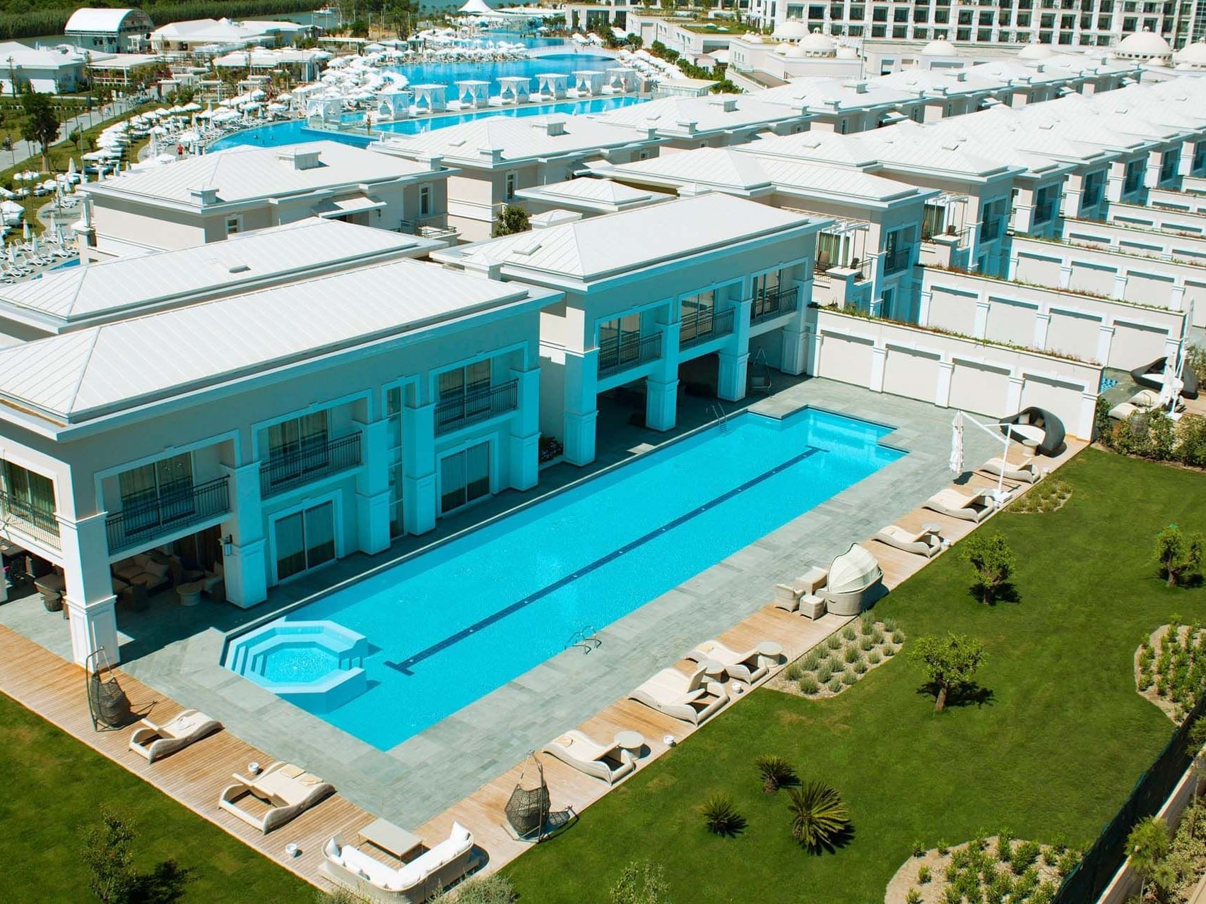 Aerial view of Titanic Deluxe Golf Belek with outdoor pool on a sunny day