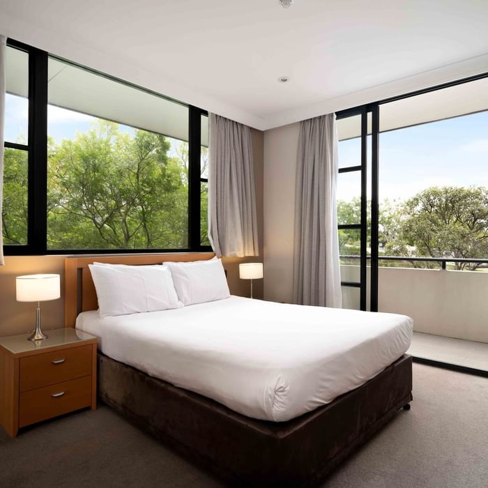 spacious bedroom with 2 large windows and balcont overlooking golf course