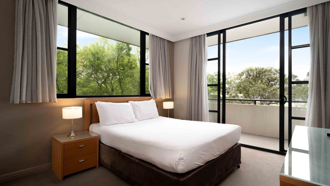 Privilege Room with large bed,  and sheer curtained windows at Mercure Kooindah Waters