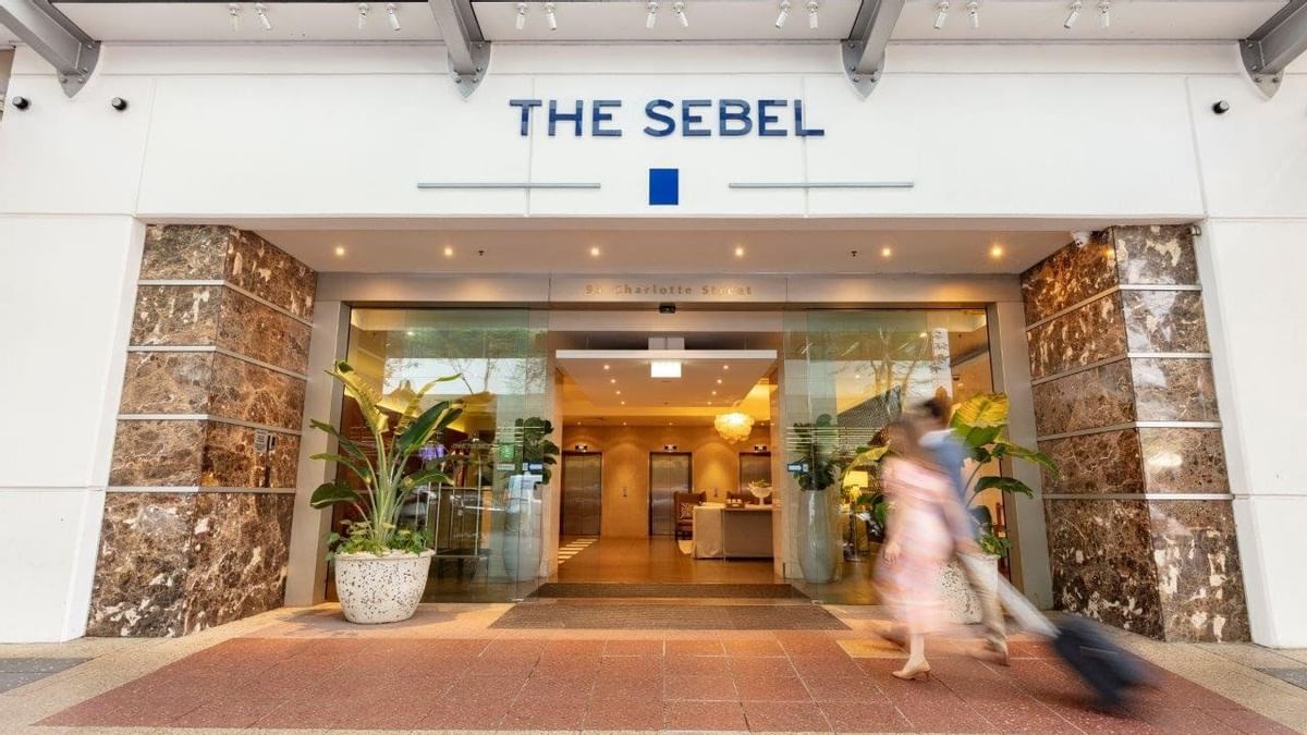 Couple going to out door at Sebel Suites Brisbane