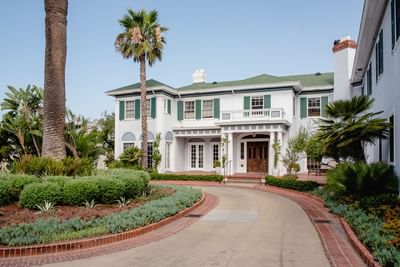 Front exterior entrance of Inn at Mt Ada featuring a circular driveway