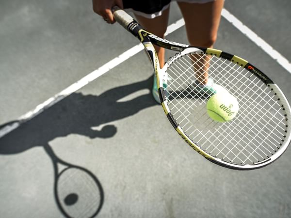 Tennis racket and a tennis ball at Topnotch Stowe Resort