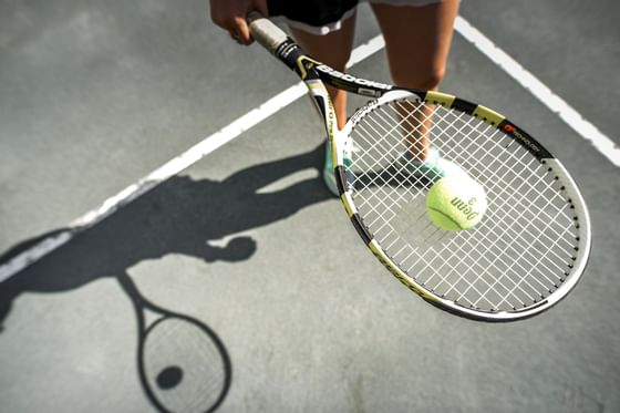 Tennis racket and a tennis ball at Topnotch Stowe Resort