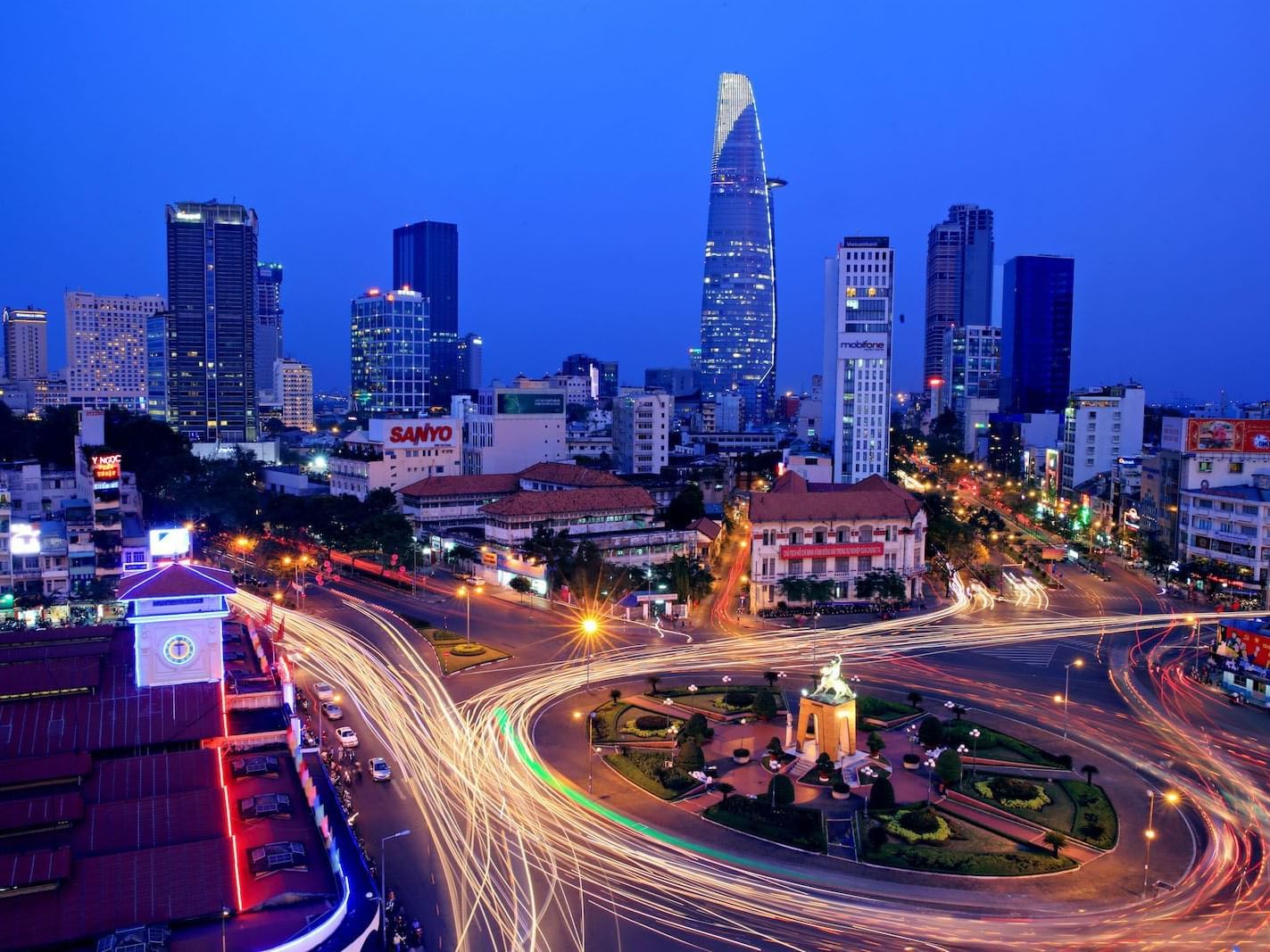 Aerial view of the Bitexco Financial Tower at night near Eastin Grand Hotel Saigon