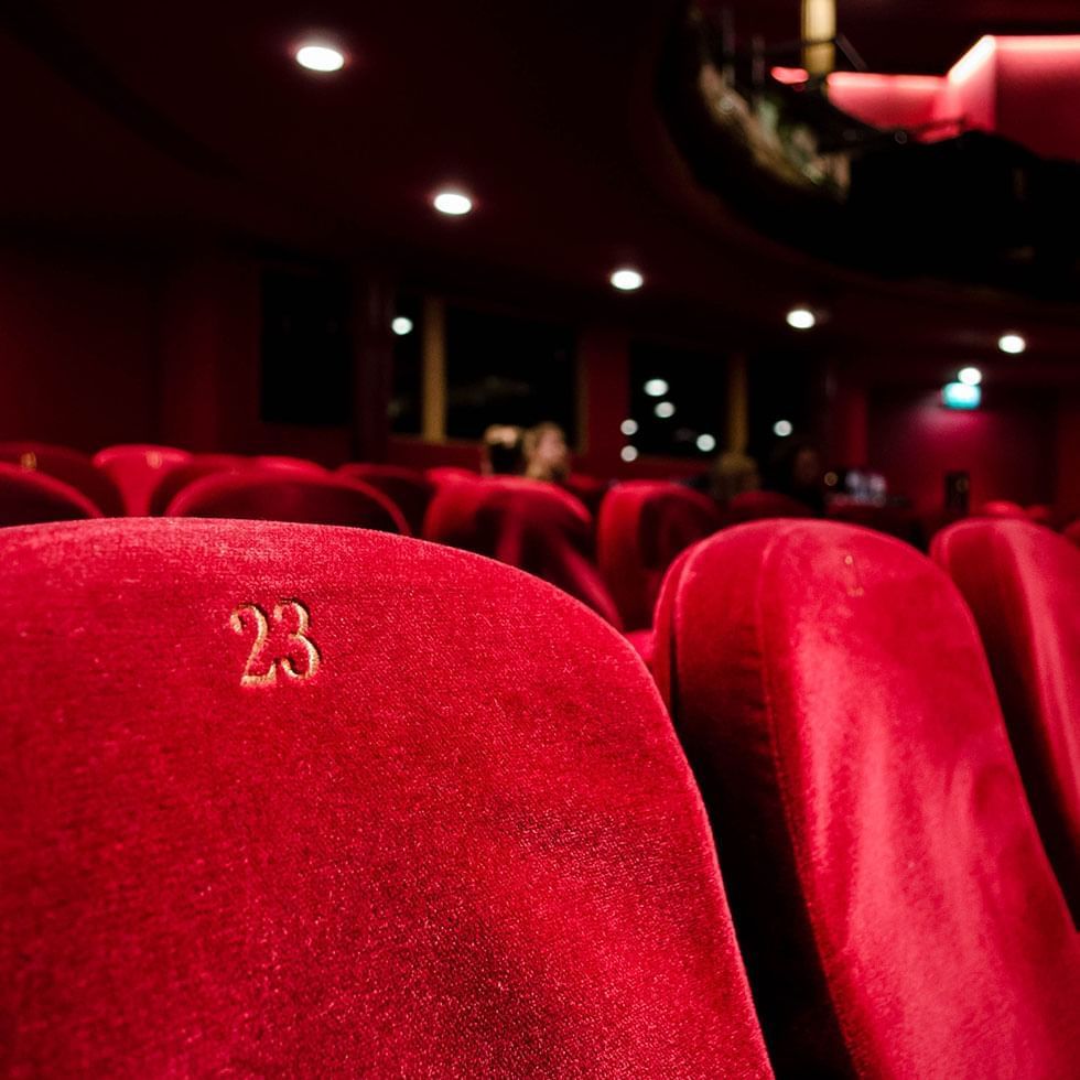 Red chairs at National Theatre near Falkensteiner Hotels