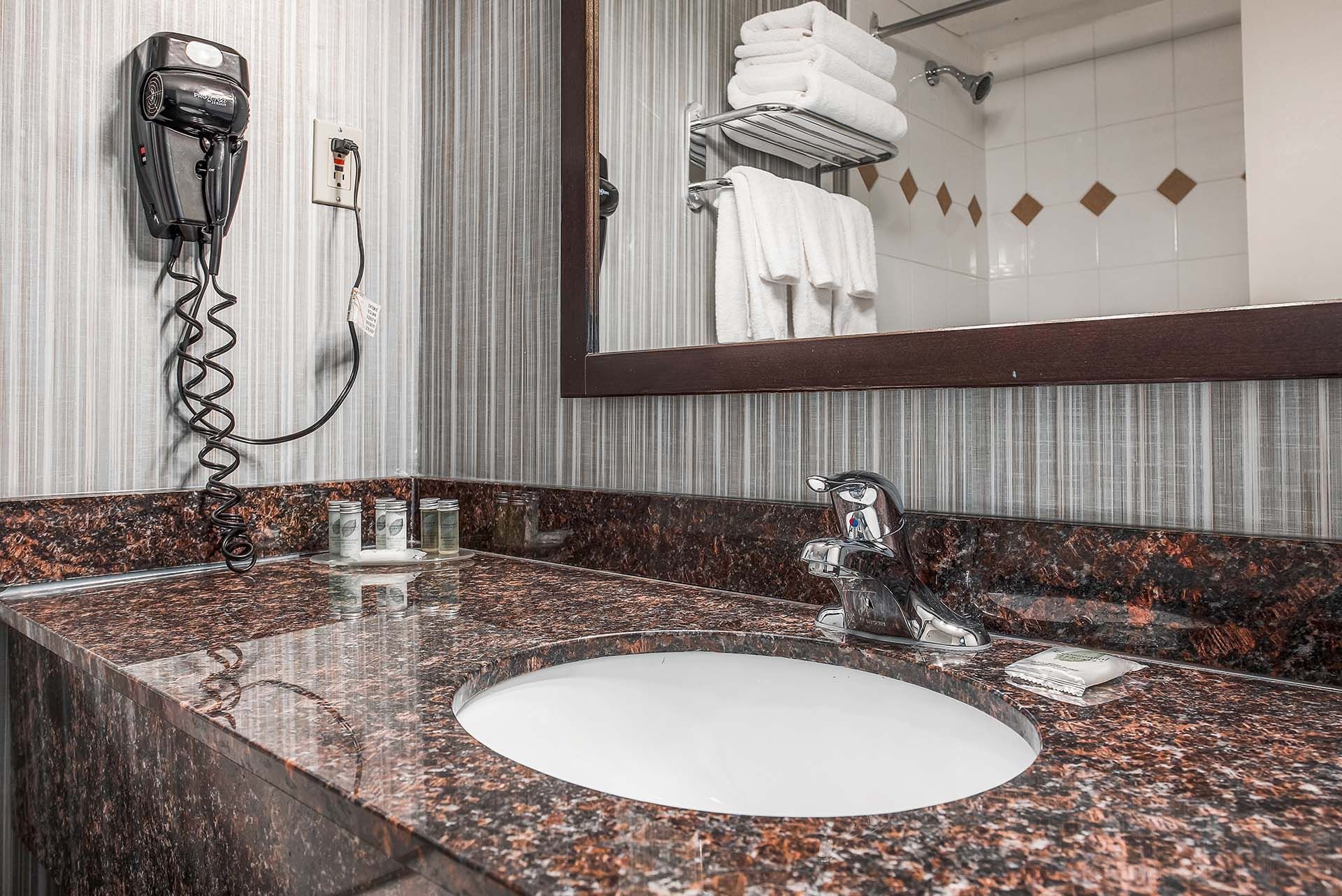 Closeup view of the vanity and hairdryer in our guest bathrooms