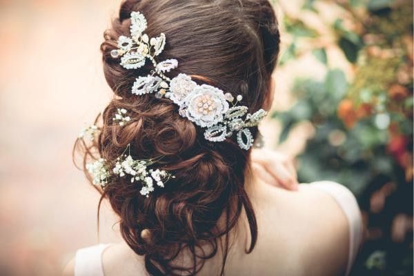Bride wearing personalised hair piece, a unique wedding veil alternative