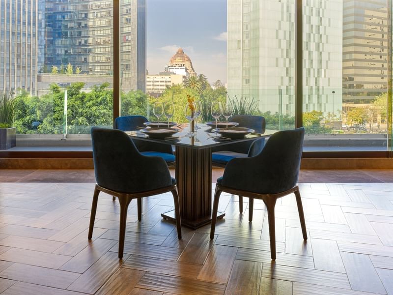 Dining table set-up by city view in a restaurant at FA Reforma