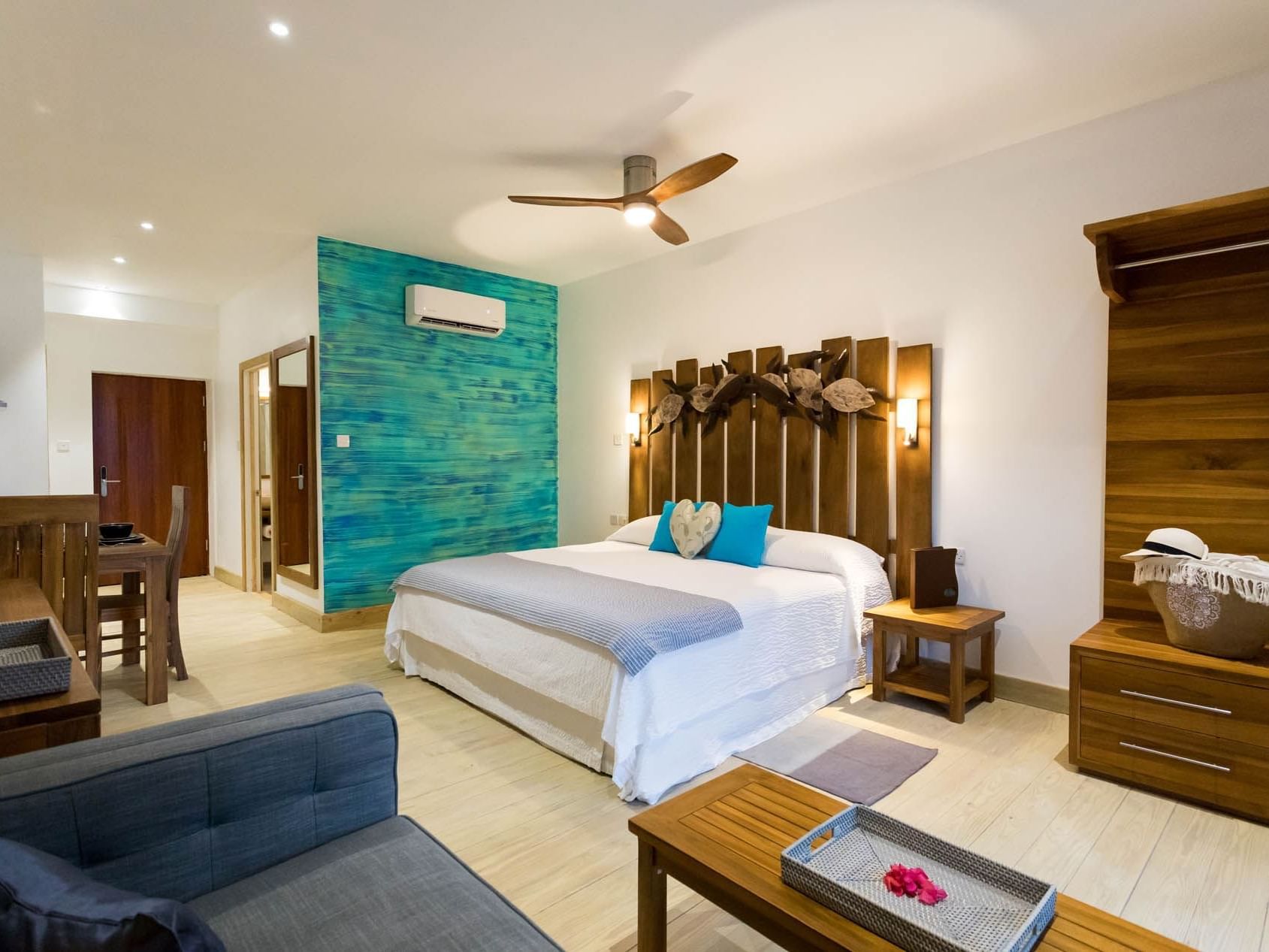 Bedroom arrangement in Cocoa Pod Room at True Blue Bay Hotel
