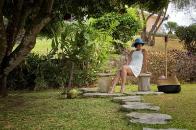 Woman reclining in Trinidad garden