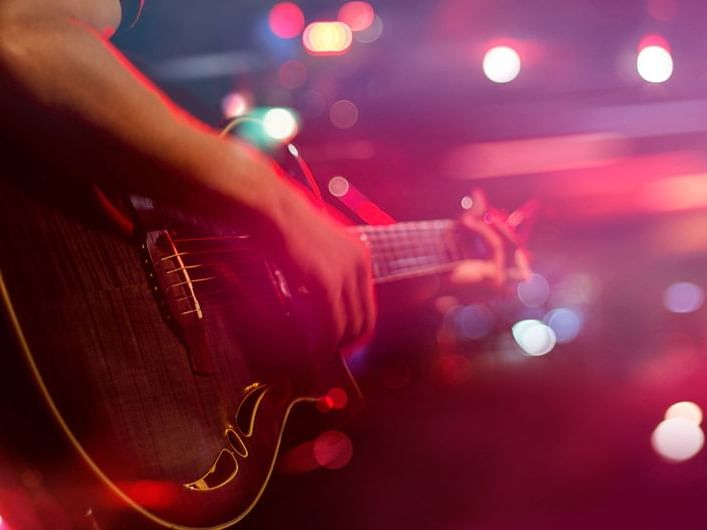 Close-up on a guitar player, St Lawrence Gap, The Abidah Hotel