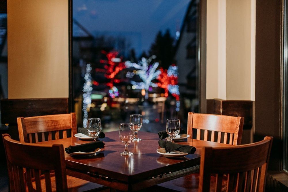 Close-up of a dining table arrangement in 21 Steps Kitchen + Bar at Blackcomb Springs Suites