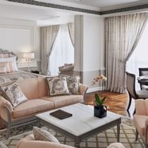 Bed & living area in Junior Suite at Palazzo Versace Dubai