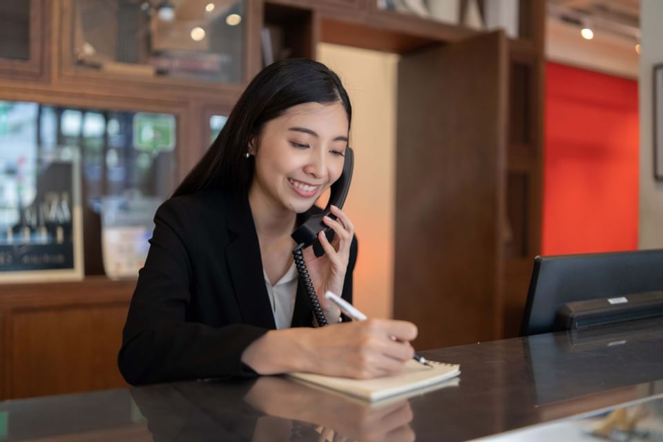 Receptionist having a phone call at Sunseeker Resort