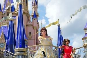 Belle in front of Cinderella's Castle in Walt Disney World, where RunDisney will be holding their Princess Half Marathon.