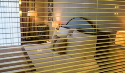 Club Deluxe Room with a twin bed & comfy chair at Eastin Grand Hotel Saigon