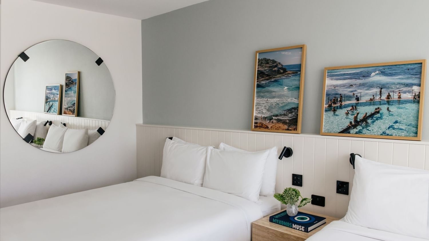 Sunset View Twin at Elysium Manly under framed ocean photography by a mirror with a nightstand, best places to stay in Manly