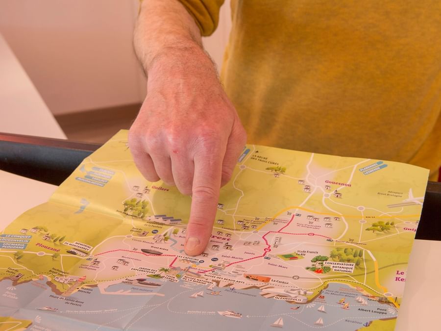 A person observing a map in Hotel Loval