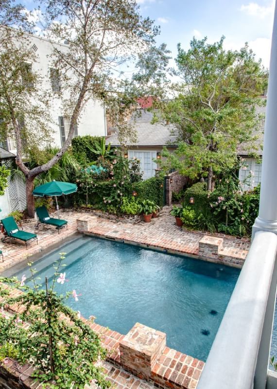 The exterior view of the outdoor pool area at Audubon Cottage