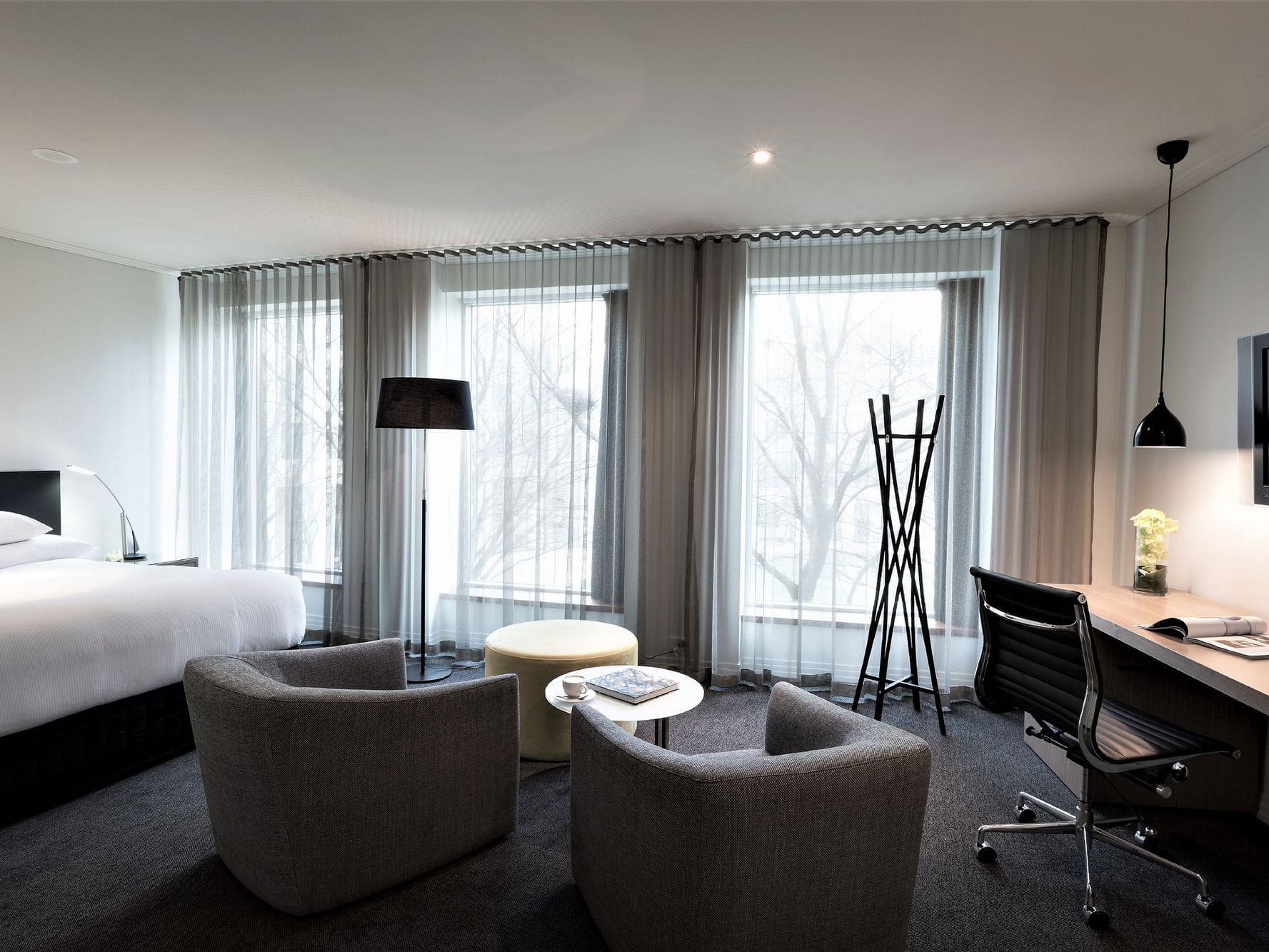 King bed, lounge area & desk in Deluxe Room at Como Melbourne