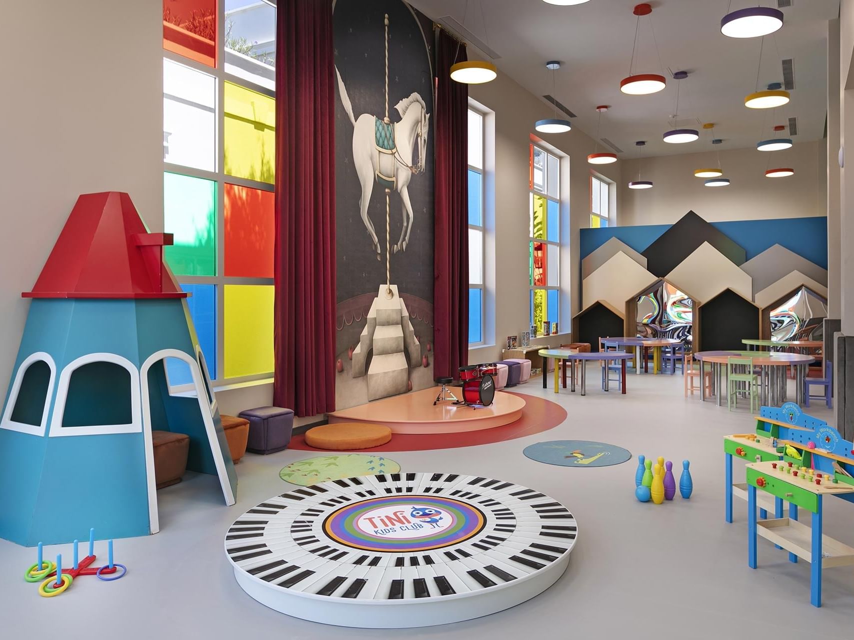 Children's playroom with toys, and mural in Tini Kids Club at Titanic Deluxe Golf Belek
