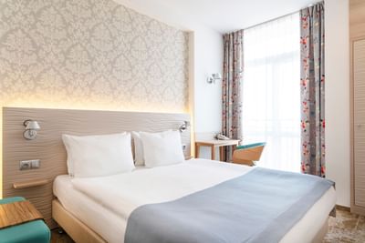 King bed in the Standard room at Metropol Hotel