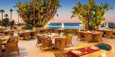 Outdoor dining with sun set at Hotel Cascais Miragem