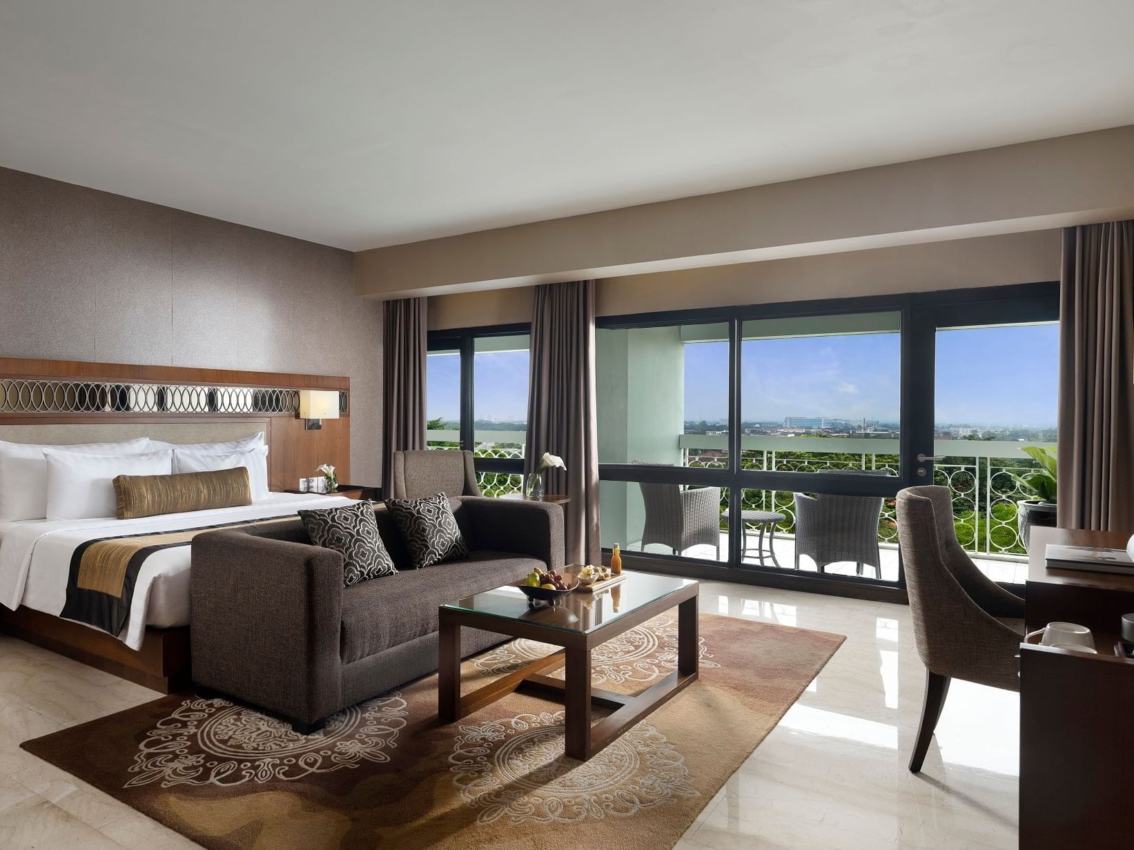 The Junior Suite with one king bed and a view in Royal Ambarrukmo Yogyyakarta