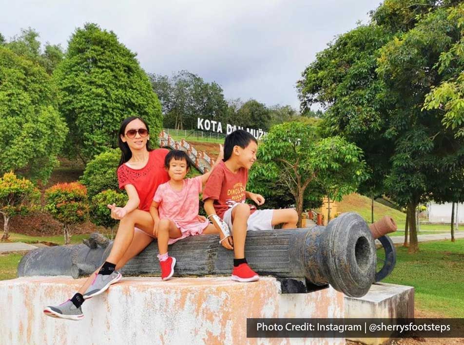 Family of three sitting on a canon - Lexis Port Dickson