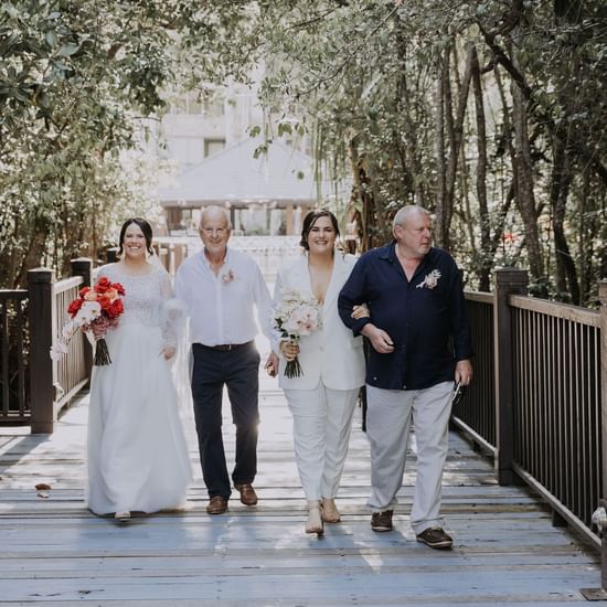 Wedding couples walking at Pullman Palm Cove Sea Temple Resort