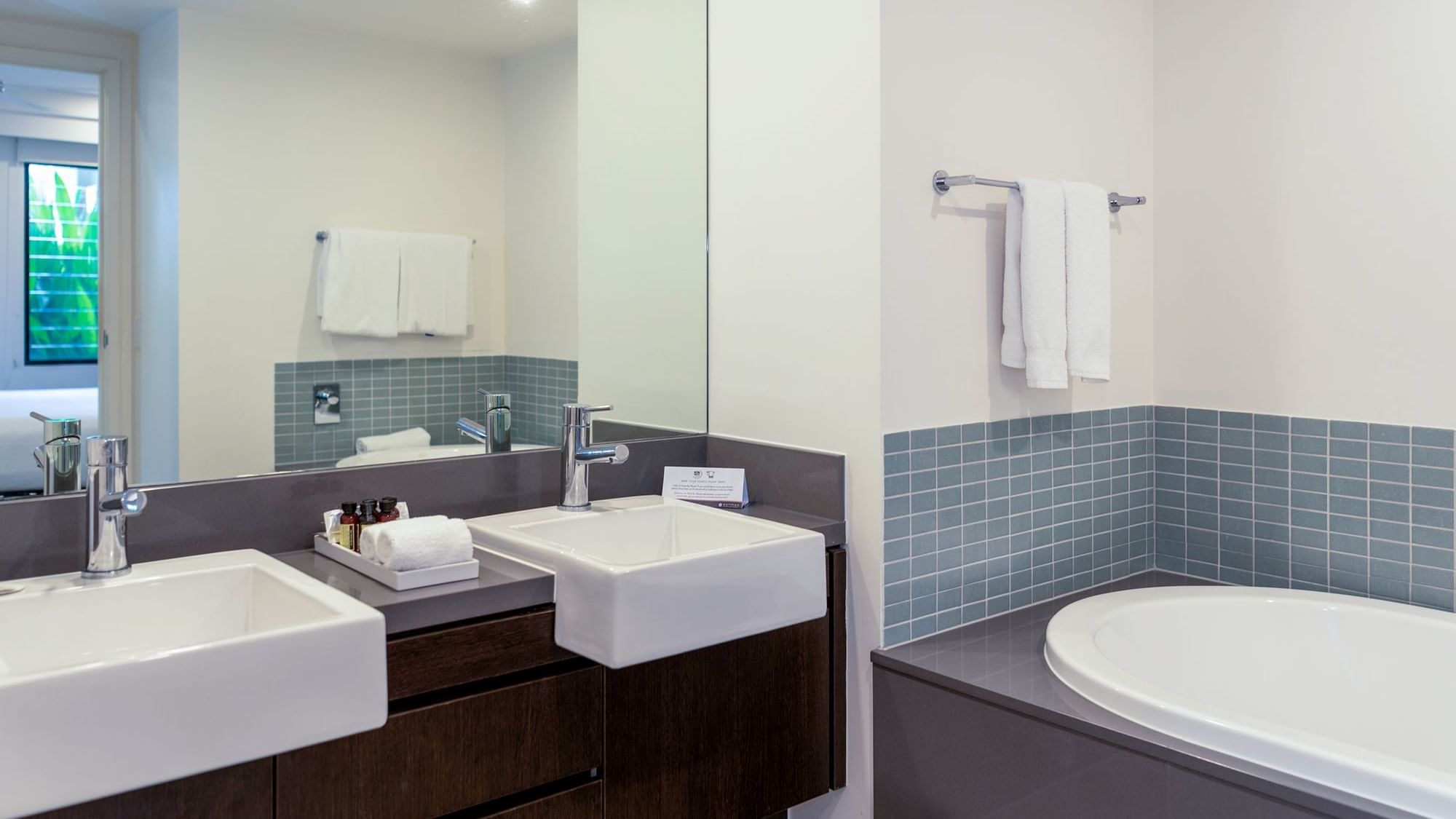 Vanity area with bathtub in Two-Bedroom Apartments at Pullman Port Douglas