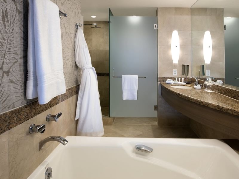 Bathroom with vanity & bathtub in 1 King Bed - Partial Ocean View Balcony at The Diplomat Resort