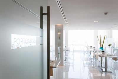 Dining tables arranged in Porto Mare Space at Hotel Presidente Luanda